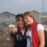 Two women with Dissociative Identity Disorder posing for a photo in a slum.
